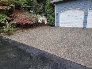 Pressure washing driveway in summer in Washington