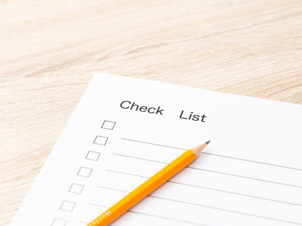 Spring Pressure Washing Checklist for Kitsap County Homes 1 Checklist sheet with pencil on a wooden desk