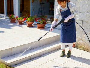 Spring Pressure Washing Checklist for Kitsap County Homes 1 Woman pressure washing outdoor patio steps